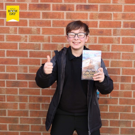 student with book on world book day